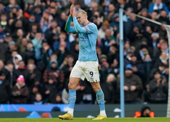 Erling Haaland pictured applauding his fans as he leaves the field after scoring a hat-trick for Manchester City against Wolves in January 2023